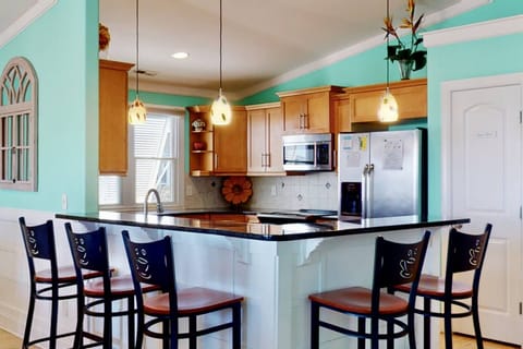 The breakfast bar has seating for a small group of people