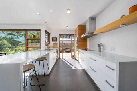 The kitchen is fully equipped and opens onto a kitchen garden