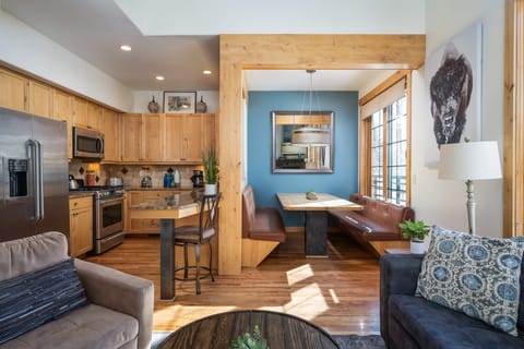 Living area easily flows into the dining area and kitchen bar top