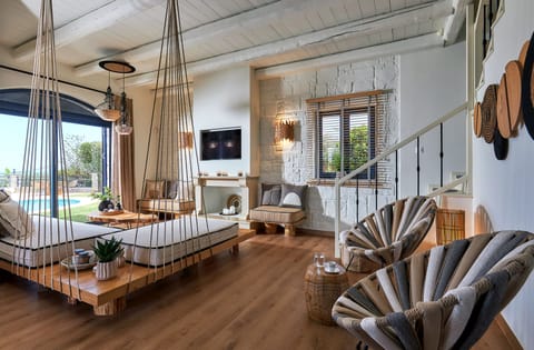 living room area with view and entrance to the pool and garden area & seaview