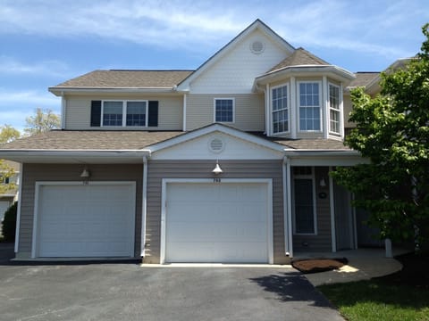 Front of home. Garage is on the right. Living space is located on second floor.