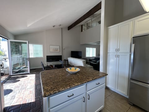 Large Family room/dining/kitchen area- patio with door that folds up!New couches