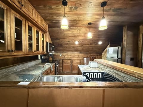 Full size fridge in the kitchen.