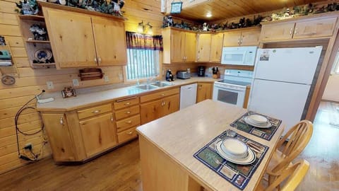 Full size kitchen with appliances, cookware, pots and pans, dishes, utensils, and basic cooking essentials.
