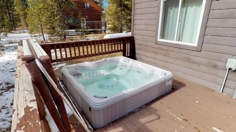 Hot tub located on the back deck perfect to unwind during your stay.