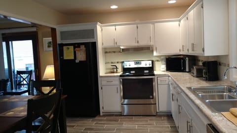  Kitchen-Fully Equipped with full size stove, refrigerator and dishwasher

