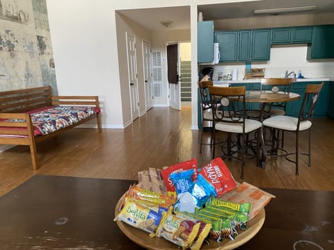 Day bed in open living/dining room 