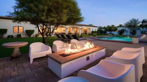 Cozy firepit next to the pool & sports court in a private fenced yard 