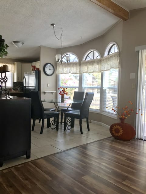 Comfortable seating for four and a view of the golf course from the dining room