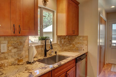 Newly remodeled kitchen with large stainless steel sink.