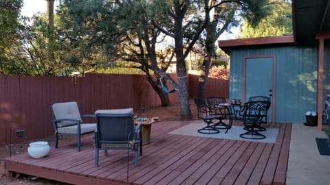 Big private wrap around yard with comfortable seating and  barbecue
