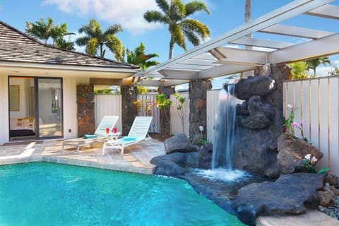 Beautiful private Hawaiian waterfall and pool, with seating and lounging room for all!