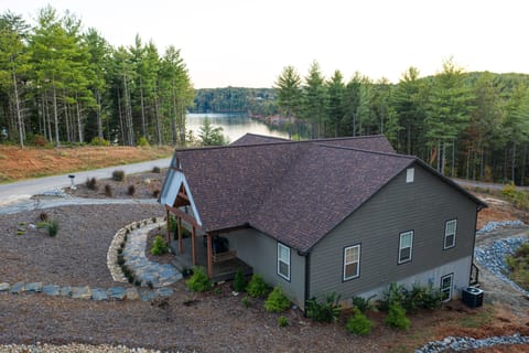 View as you pull up to home, stone stairway to front entrance and side entrances