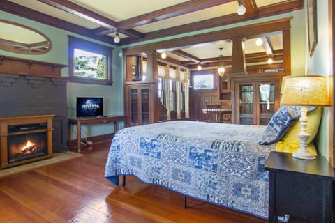 Queen bed, Smart TV, Electric Fireplace shown.

(Queen air mattress provided for the 3rd person.) 

**Kitchenette means mini fridge, microwave, coffee maker, plates, cups. Toaster available upon request.**

This is a non-smoking property