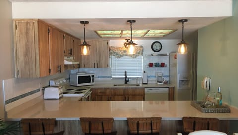 Kitchen with wine cooler, reg coffee pot and Keurig coffee pot and more. 