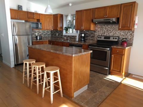 Our open concept kitchen with modern appliances.
