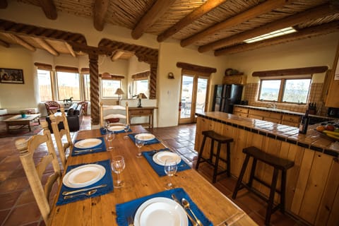 Dining area. Table can seat up to 7. Additional seating for 2 at kitchen counter