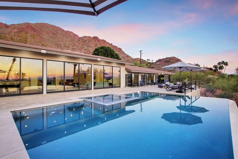 Indulge in a sleek infinity pool, panoramic mountain views, and impeccably designed outdoor spaces perfect for both serene relaxation and elevated entertaining.