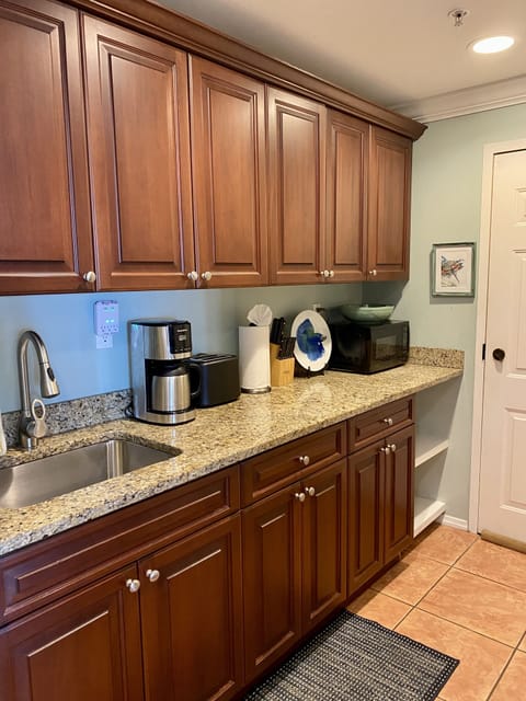 Kitchenette: toaster, microwave, blender, coffee maker, and full size fridge