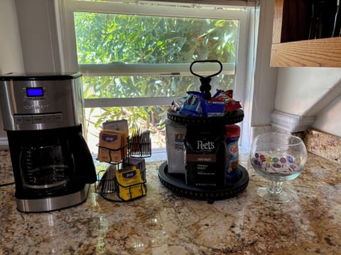 Breakfast area with Peets coffee, tea bags, sugar and cream.