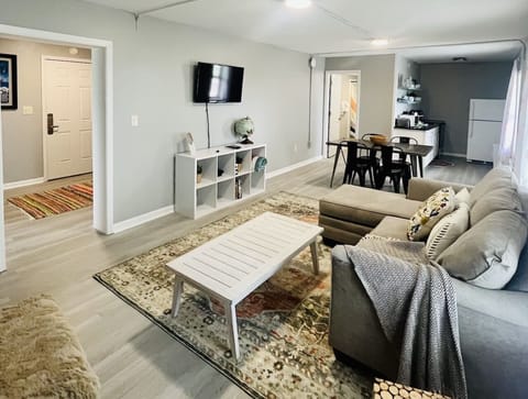 Open floor plan that connects the living room, dining room, and kitchen.