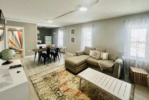 Open floor plan that connects the living room, dining room, and kitchen.
