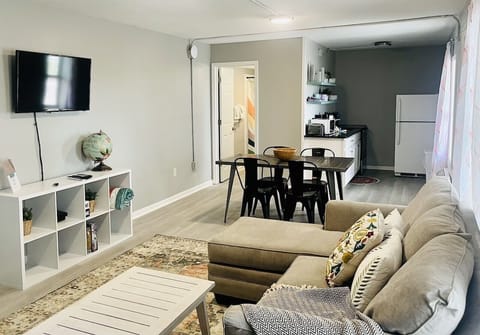 Open floor plan that connects the living room, dining room, and kitchen.