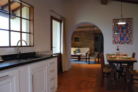 The Kitchen and dining area leading to the downstairs sitting room