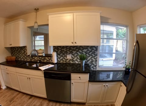 This lovely kitchen will have a view to the pool.