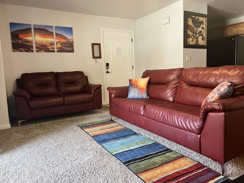 Enjoy your home away from home. Comfortable living room with Sofas and TV.