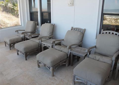 Balcony with comfortable lounging chairs, perfect for relaxing.