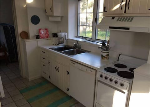 Cottage Kitchen with Stove, Microwave, Dishwasher, and Coffee Machine