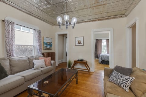 Living room with Sofa bed, Roku TV, tin ceiling, fast wifi, cute and cozy!