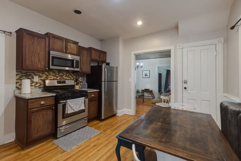 Dining table seats 4, extra folding chairs available