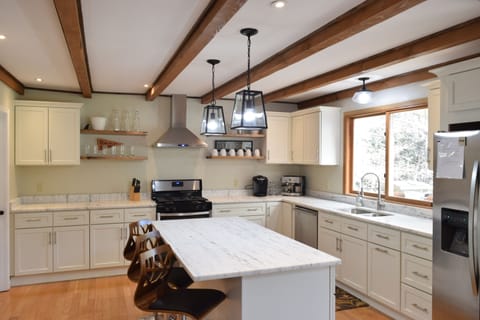 Cook's kitchen with gorgeous leathered countertop, and large island with a view!