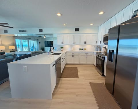 Newly renovated kitchen featuring luxury vinyl flooring, beautif - Newly renovated kitchen featuring luxury vinyl flooring, beautiful stainless steel appliances, quartz counters and all the necessities you need for the best vacation!