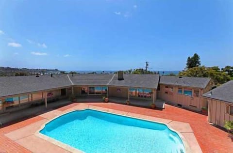 Birdseye view of pool/house overlooking ocean.