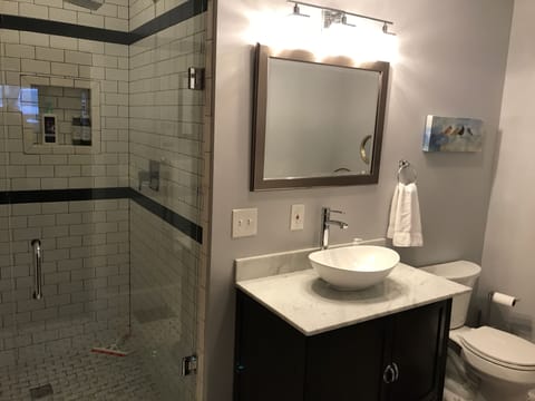 Large walk-in, subway tiled shower with rainhead!