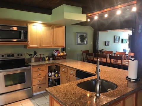 Kitchen with all plates glasses air fryer coffee maker dish washer 