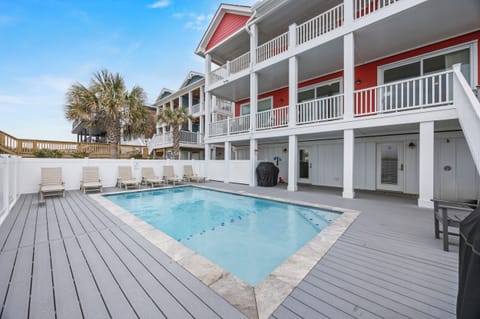 Dive into your private pool oasis, surrounded by spacious deck lounging and tropical palms swaying overhead.