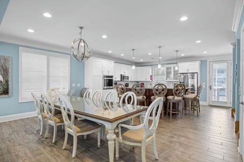 Gather around this elegant dining table for memorable meals, then chat at the kitchen island in your beautifully appointed space.