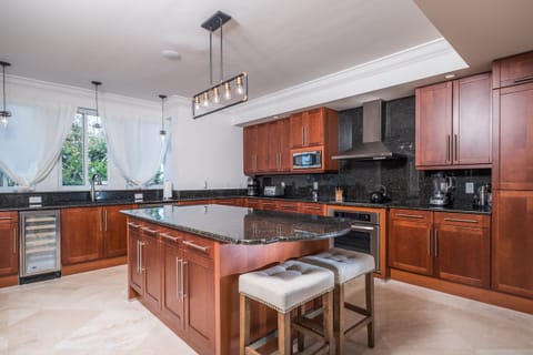 Residence #3826 - Spacious Kitchen with Center Island & Adjoining Laundry Room