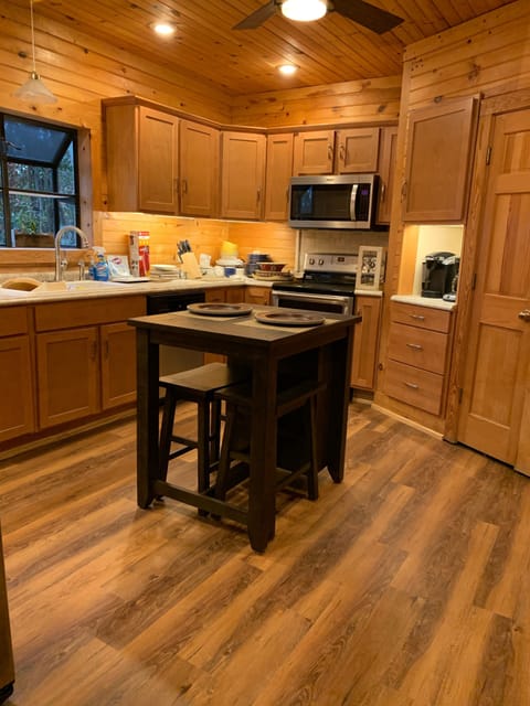 Full Kitchen with Refrigerator, stove, microwave, Keurig & drip coffee area.