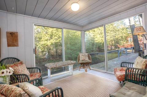 Three-season porch for morning coffee. Views of quiet backyard and shade garden