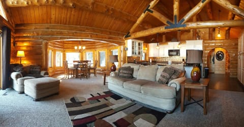 The cabin features Vaulted ceilings and large  windows to let natural light in
