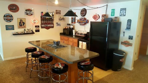 Lower level bar has an ice maker, a 2nd oven/stove, refrigerator & microwave.