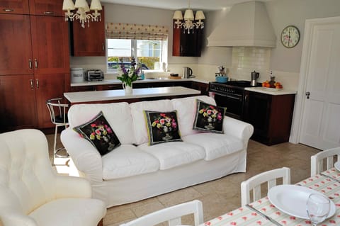 Large kitchen & dining area, with wall mounted 42" TV