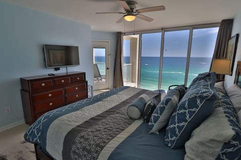 Master bedroom with breathtaking ocean views and private access to balcony.