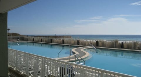 View of the large heated freshwater pool & Gulf of Mexico just steps from patio