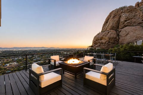 Fire pit at golden hour. Camelback rock, city skyline.